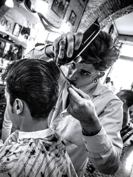 master cutting a client's hair