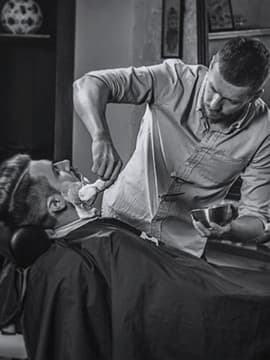 master shaves the client's beard