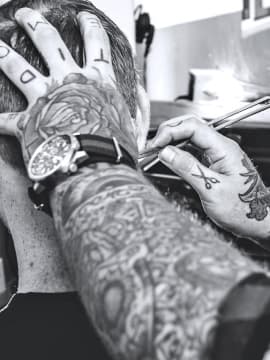 master cutting a client's hair